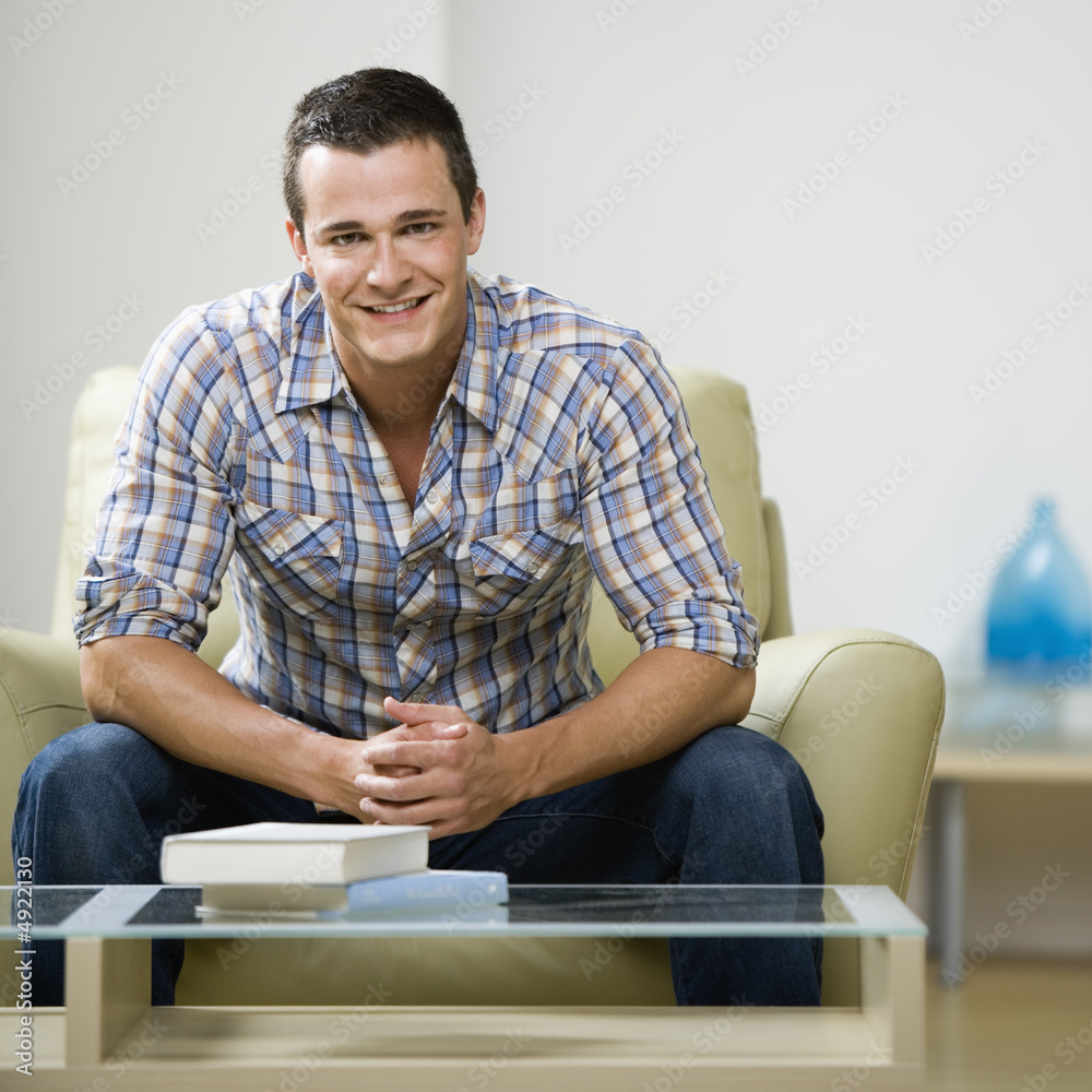 Man sitting in chair Man sitting in chair