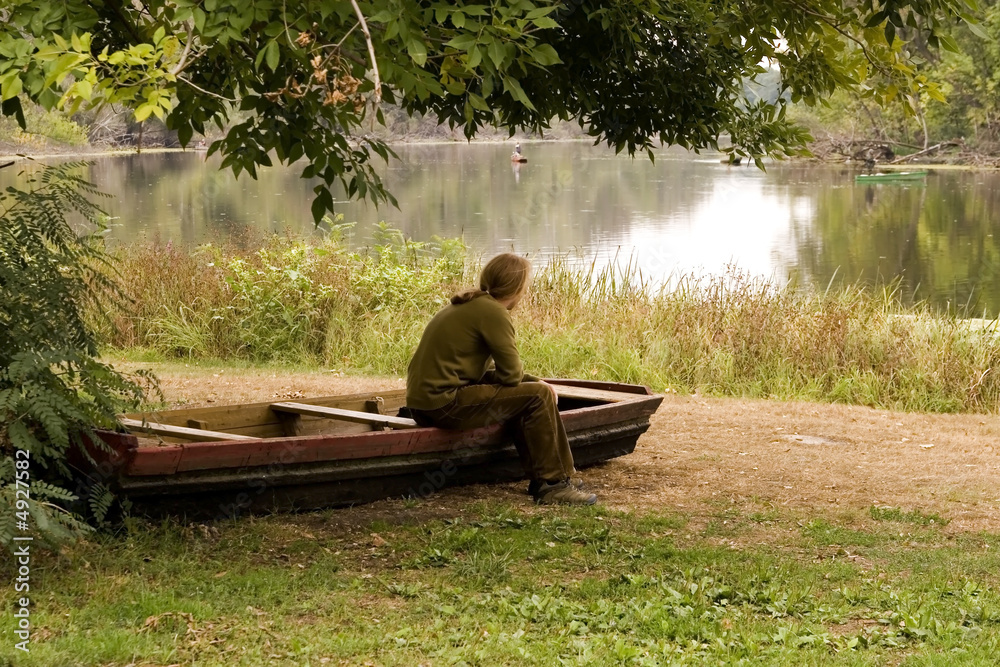 A man is working with her nootebook in outdoors A man is working with her nootebook in outdoors