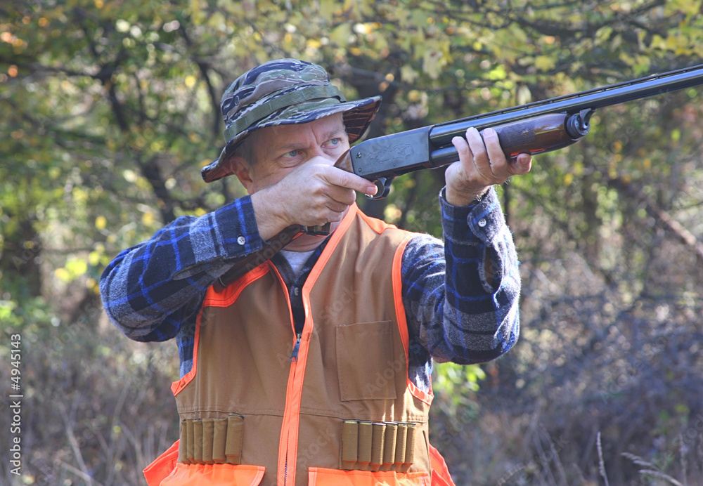 Fototapeta premium Hunter Shooting in Field