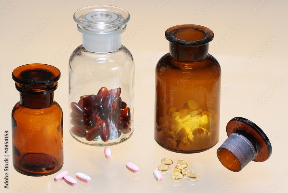 Glass full of pharmaceuticals on color background Glass full of pharmaceuticals on color background