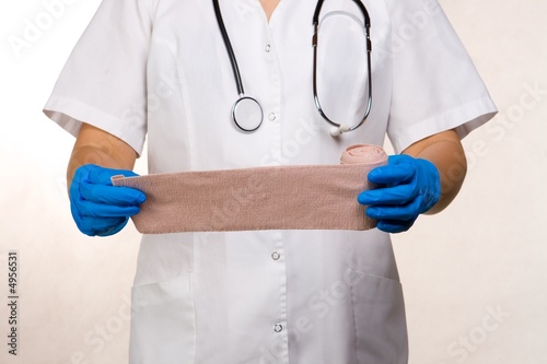 Apply bandage with gloves