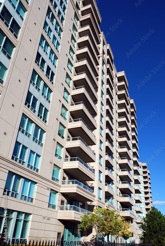 modern condominium apartment building, deep blue sky