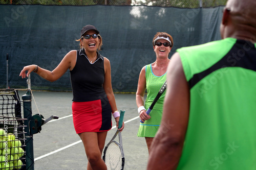female tennis players laughing