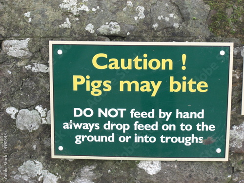Caution Pigs May Bite Sign