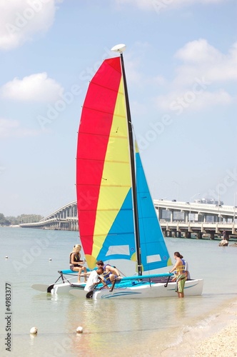 Vacationers Launching a Catamaran