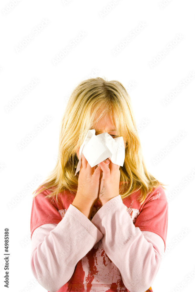 Young blond girl sneezing in the handkerchief Young blond girl sneezing in the handkerchief