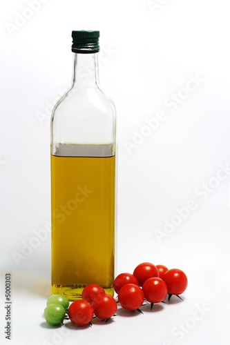 Cherry tomatos with bottle of olive oil