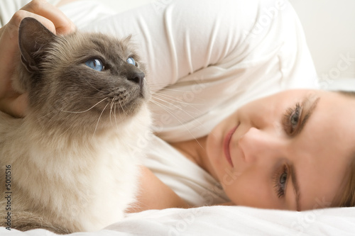 Blue eye cat with woman