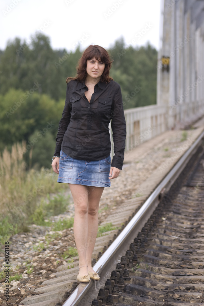 Yound Lady walking near Railway