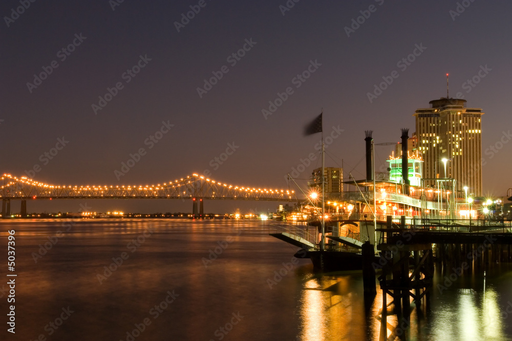 Hotels and bridge over Mississippi river at dusk