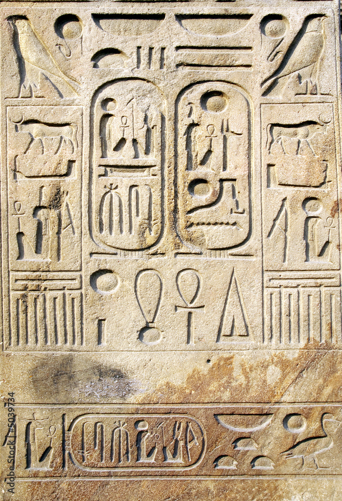 Egyptian hieroglyphs at stone bas-relief Egyptian hieroglyphs at stone bas-relief