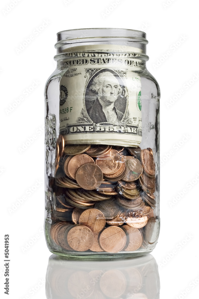 jar full of pennies and dollar bills jar full of pennies and dollar bills