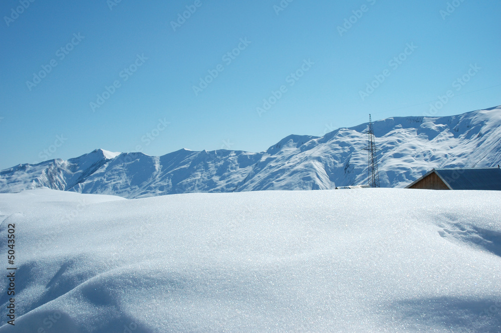 High mountains under snow in the winter High mountains under snow in the winter