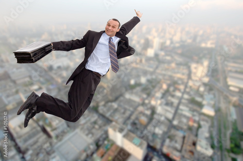 super businessman flying over big city