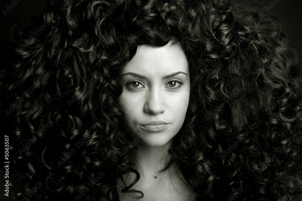 Fototapeta premium Elegant girl with curly hair