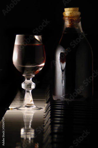 home made liquor of jabuticaba, bottle and glass