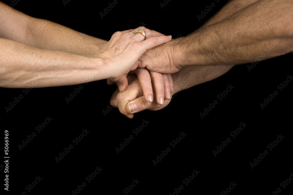 Man & woman clasping hands Man & woman clasping hands