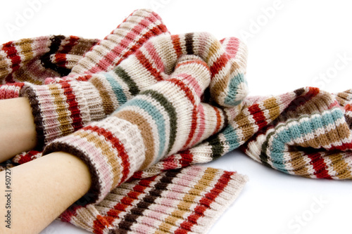 Hands in mittens with winter scarf