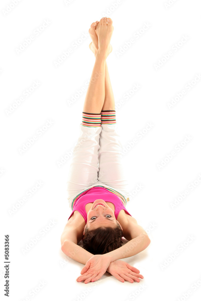 Woman lying down, raising legs in air Woman lying down, raising legs in air