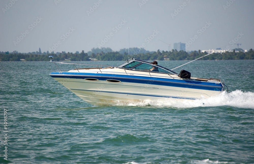 Fototapeta premium White and Blue Motor Boat