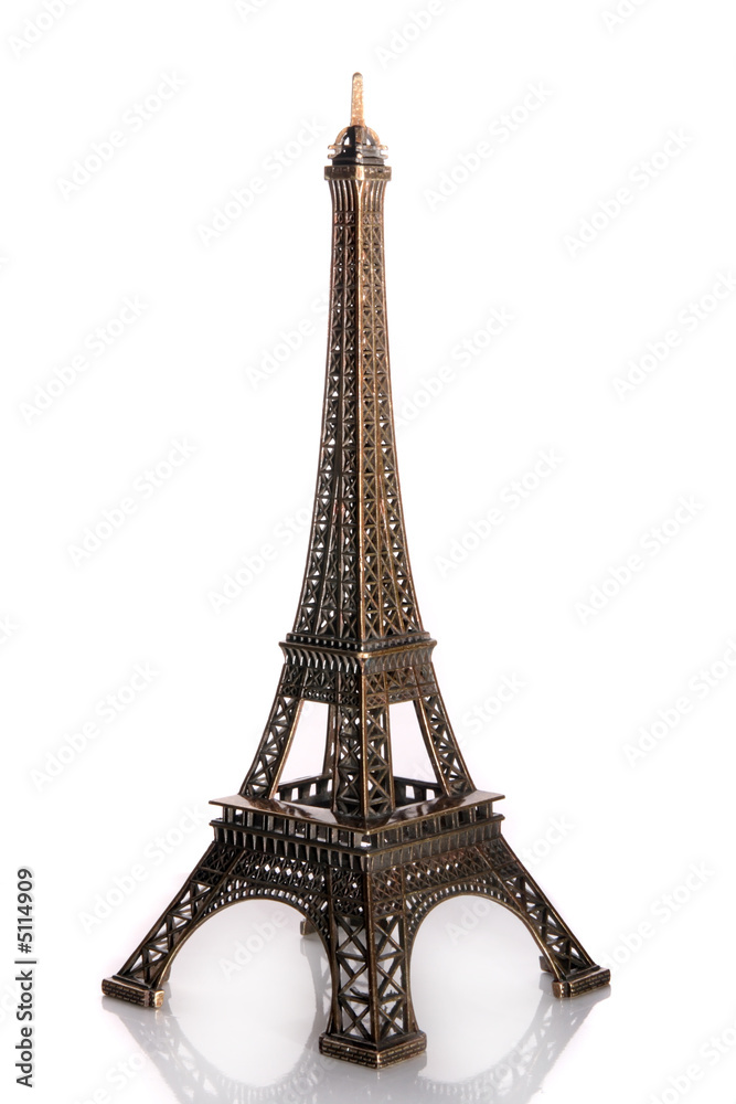 Small bronze of Eiffel tower figurine isolated on white backgrou
