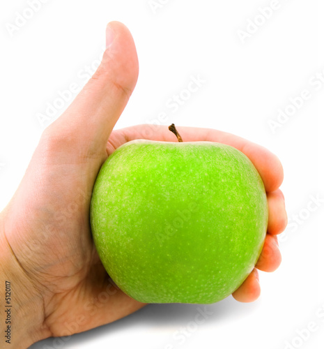 Thumbs up with an apple, isolated on white.