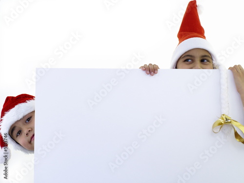 children with a big christmas card