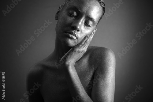 Nude woman with silver make-up