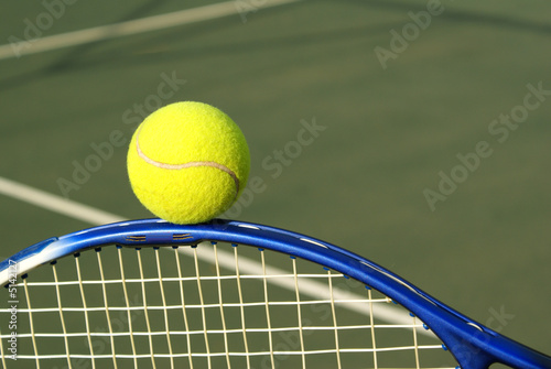 Tennis ball and racquet © Elzbieta Sekowska