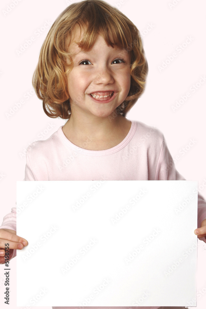 Young blond girl holding a white paper with room for text Young blond girl holding a white paper with room for text
