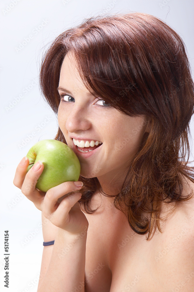 Beautiful girl with a green apple 