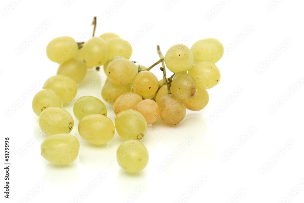 Cluster of green tasty grapes on a white background