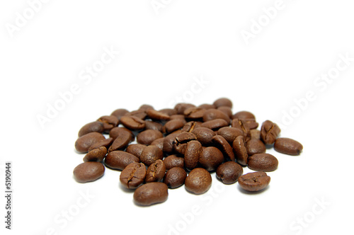 Heap of coffee beans isolated on white