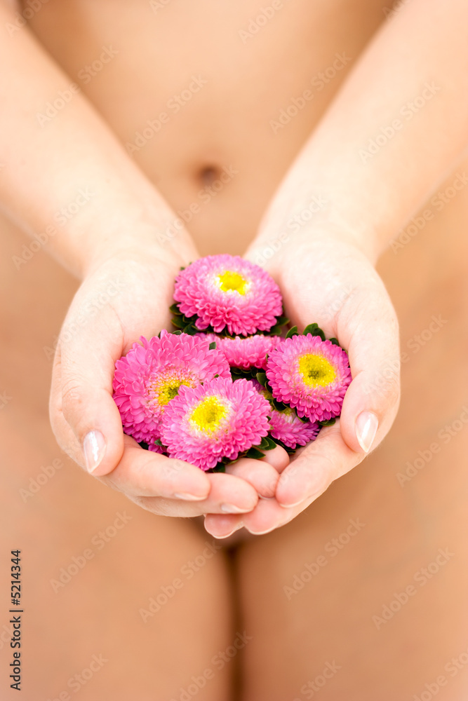 Naked woman holding flowers Naked woman holding flowers