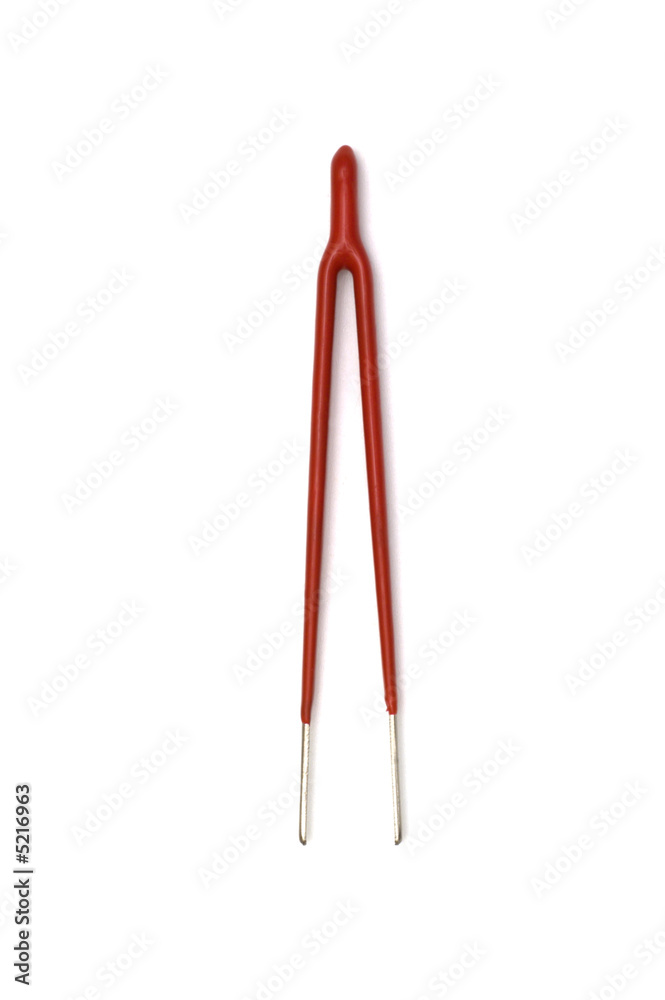 red tweezers on white background