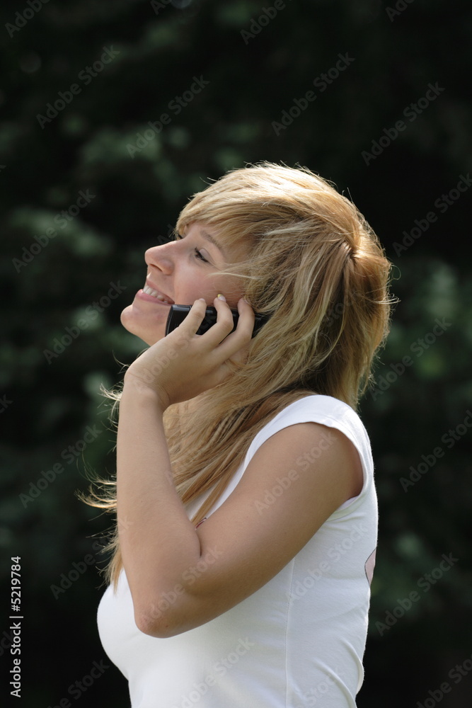 Naklejka premium The girl who was speaking by phone