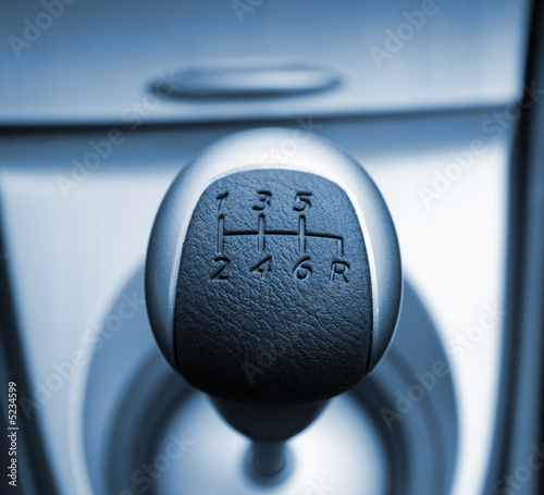 Six speed gear stick toned in blue (shallow DoF)