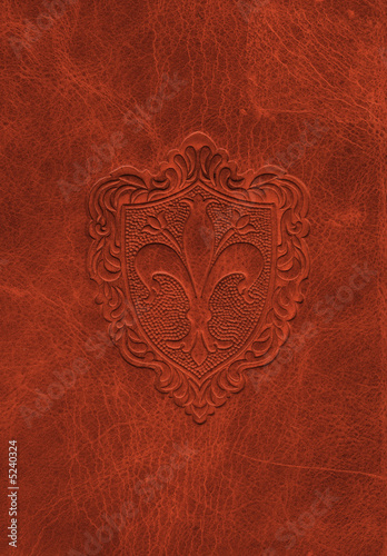 Vintage leather texture with the fleur-de-lis symbol