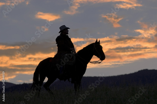 Cowboy on ridge at dawn © outdoorsman