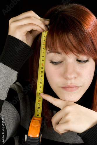 Girl pointing at a measuring tool