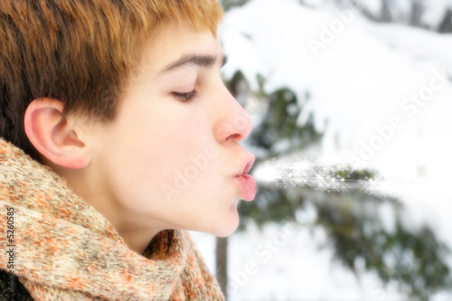 teenager blowing magic stars