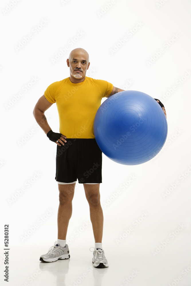 Man holding exercise ball.