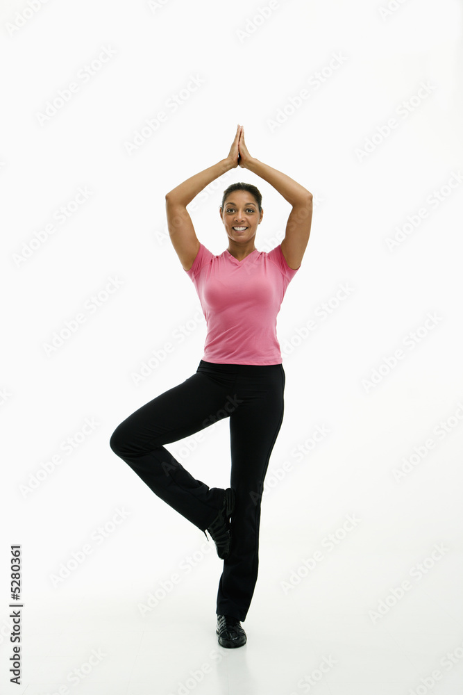 Woman practicing yoga.