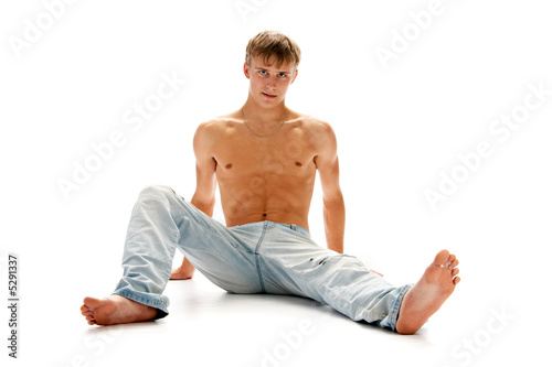 barefoot man in jeans