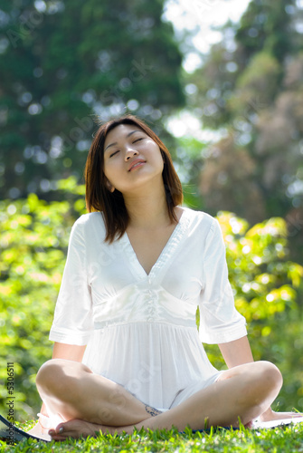 Women meditation at the park