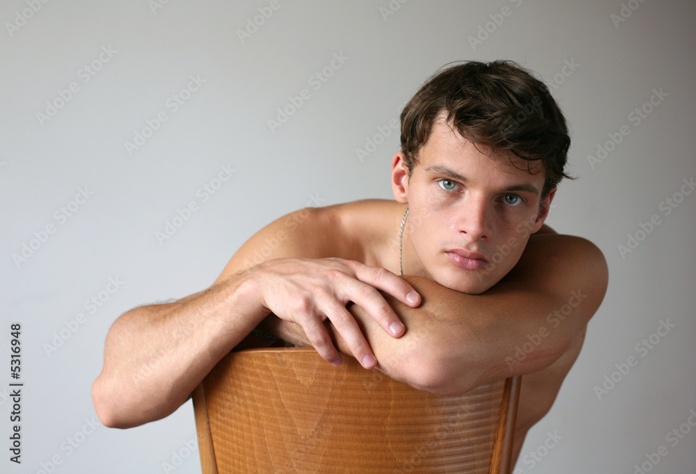 Sexy Man on the Chair. Copy Space. Sexy Man on the Chair. Copy Space.