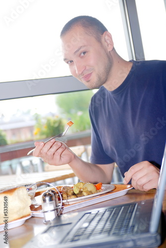 man eating healthy food it an restaurant photo