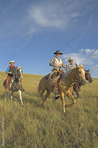 Cowboys on horseback