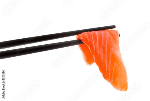 Sushi with chopsticks shot on white.