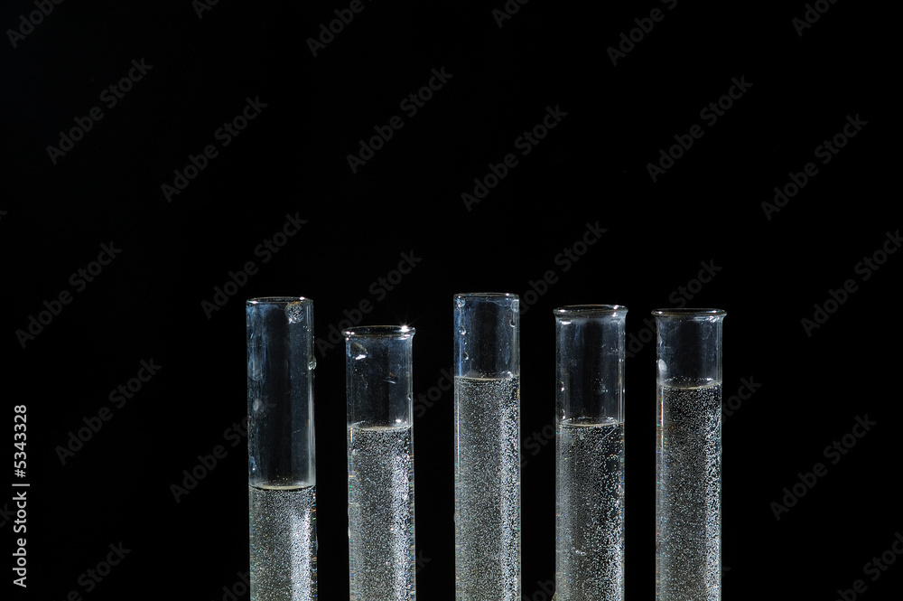 chemistry tube with micro-drop isolated on black background